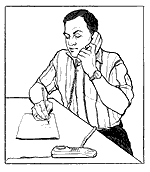 Man talking on phone, writing down information.